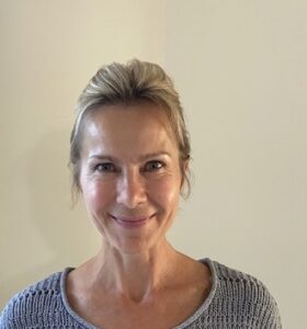 Eva with a friendly smile